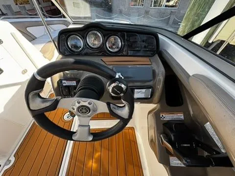 Slide: The Image of 2011 Yamaha Boats SX240 HO dashboard with steering wheel and instrument panel. - 8