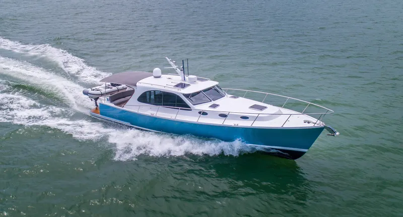 Slide: The Image of 2026 Palm Beach Motor Yachts PB42 cruising on open water, showcasing sleek design and performance. - 15