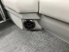 Slide: The Image of 2024 Sweetwater 2286SBCX boat interior with speaker and cushioned seating. - 8