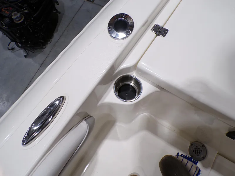 Slide: The Image of 2024 ShearWater 250 SS Carolina boat livewell and storage compartment. - 17