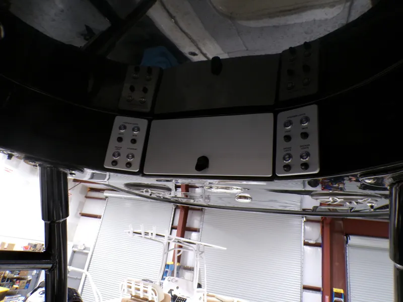 Slide: The Image of 2024 ShearWater 250 SS Carolina boat underside with speakers and sleek black finish. - 23