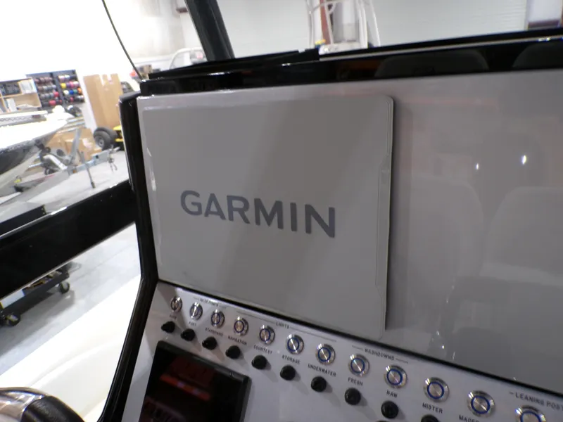 Slide: The Image of Control panel of 2024 ShearWater 250 SS Carolina boat with Lenco jackplate switches. - 27