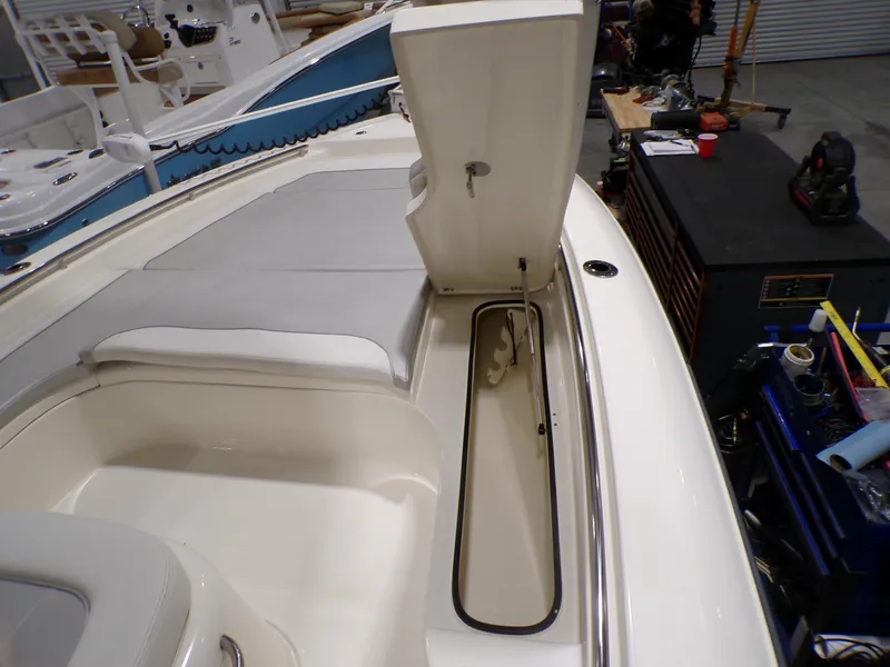 Slide: The Image of 2024 ShearWater 250 SS Carolina boat interior with cushioned seating. - 31