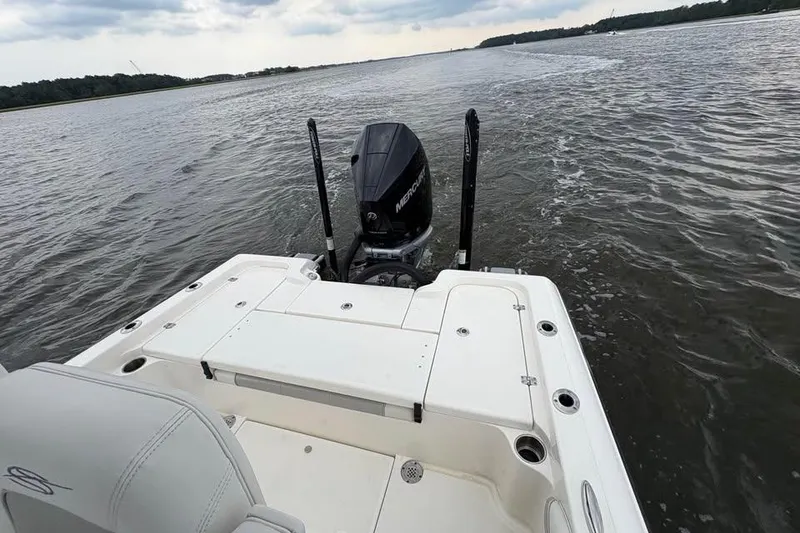 Slide: The Image of 2024 ShearWater 250 SS Carolina boat on water, featuring a powerful Mercury engine. - 35