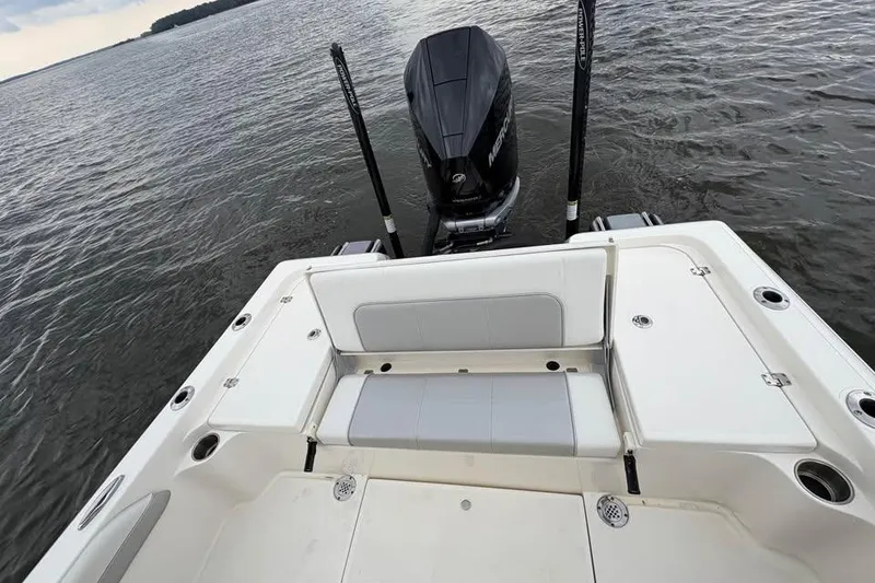 Slide: The Image of 2024 ShearWater 250 SS Carolina boat with outboard motor on calm water. - 37
