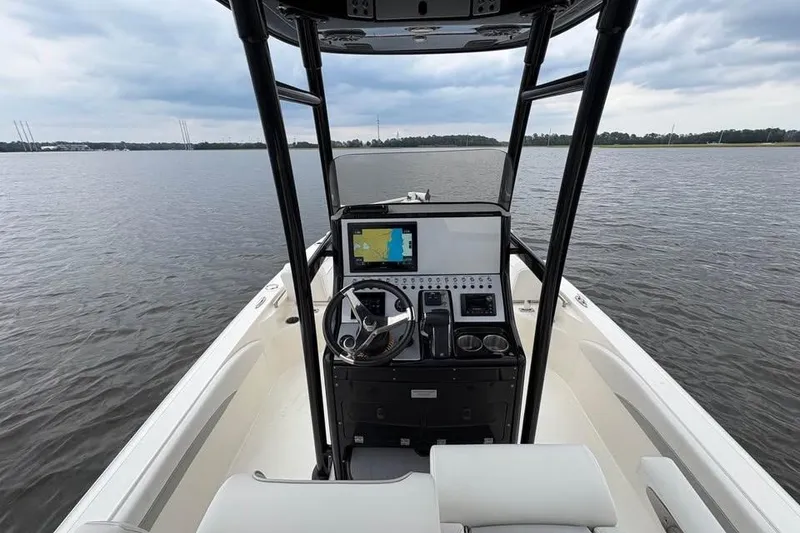 Slide: The Image of 2024 ShearWater 250 SS Carolina boat interior with navigation system on calm water. - 40