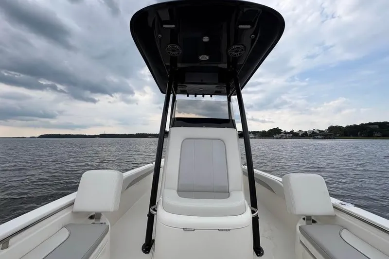 Slide: The Image of 2024 ShearWater 250 SS Carolina boat on calm water under cloudy sky. - 41
