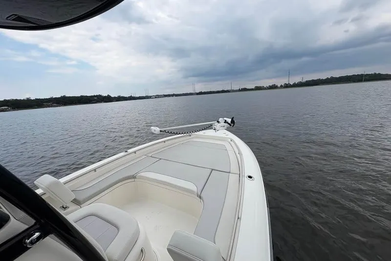 Slide: The Image of 2024 ShearWater 250 SS Carolina boat on calm waters under cloudy sky. - 46
