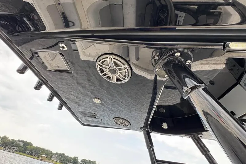 Slide: The Image of 2024 ShearWater 250 SS Carolina boat underside with speakers and sleek black finish. - 47
