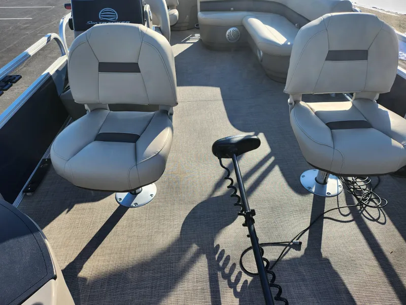 Slide: The Image of 2023 Sun Tracker Bass Buggy 18 DLX interior with seating and trolling motor. - 10