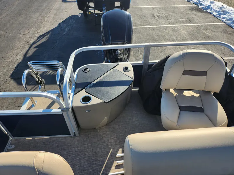 Slide: The Image of 2023 Sun Tracker Bass Buggy 18 DLX pontoon boat interior with seating and storage. - 14