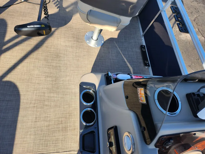 Slide: The Image of 2023 Sun Tracker Bass Buggy 18 DLX interior with seating and control panel. - 21