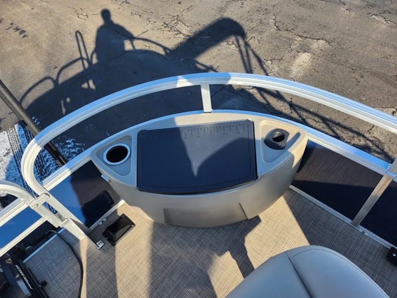 Slide: The Image of 2023 Sun Tracker Bass Buggy 18 DLX boat deck with cup holders and seating. - 24