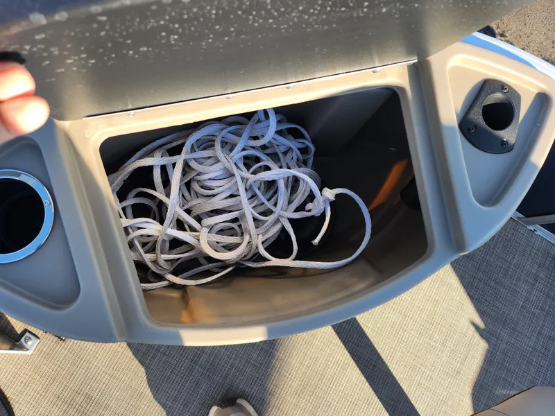 Slide: The Image of Storage compartment with rope on a 2023 Sun Tracker Bass Buggy 18 DLX boat. - 25