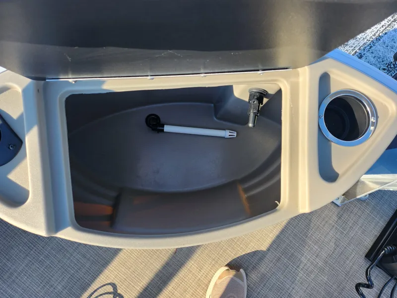 Slide: The Image of Storage compartment on 2023 Sun Tracker Bass Buggy 18 DLX boat with cup holder. - 26