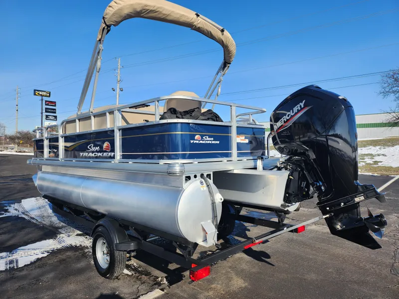 Slide: The Image of 2023 Sun Tracker Bass Buggy 18 DLX pontoon boat with Mercury outboard motor. - 3