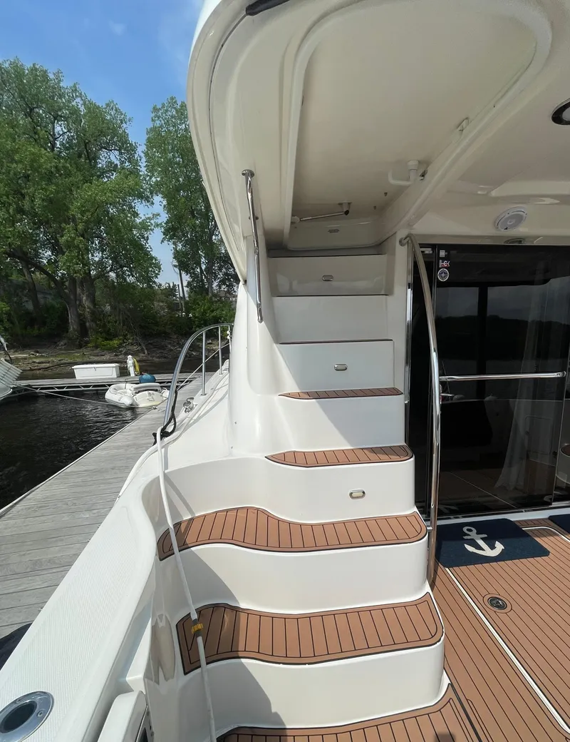 Slide: The Image of Staircase on 2005 Sea Ray 500 Sedan Bridge yacht with teak decking. - 22