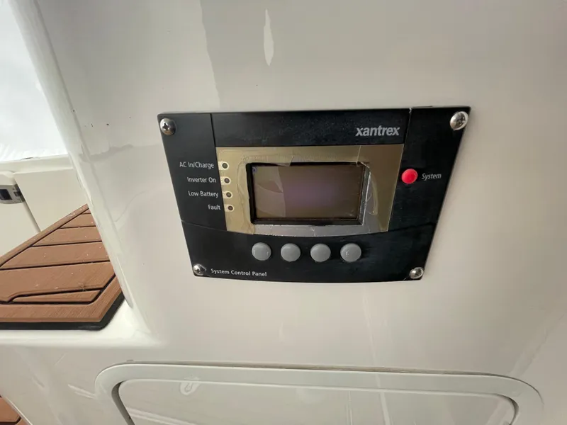 Slide: The Image of Control panel on 2005 Sea Ray 500 Sedan Bridge yacht, featuring Xantrex system. - 23