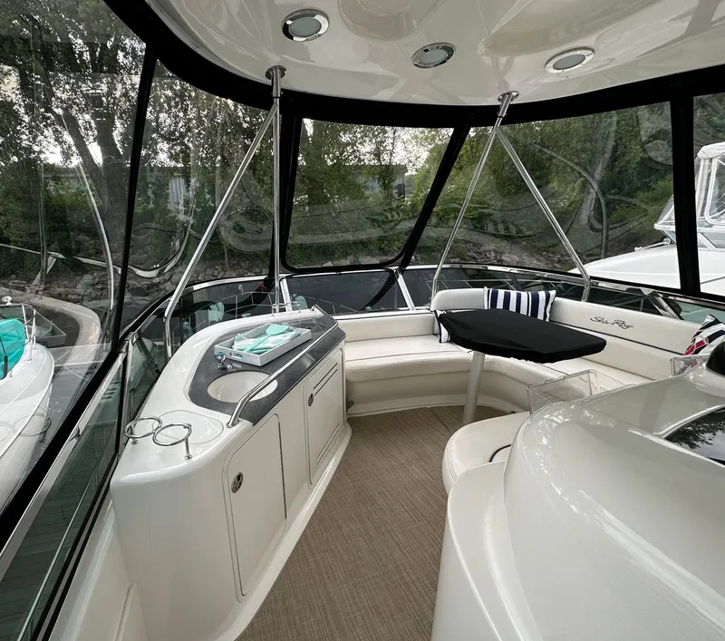 Slide: The Image of Interior of 2005 Sea Ray 500 Sedan Bridge yacht with seating and table. - 26