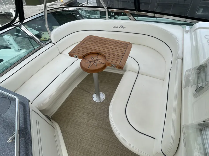 Slide: The Image of Luxurious 2005 Sea Ray 500 Sedan Bridge yacht with elegant white seating and wooden table. - 29