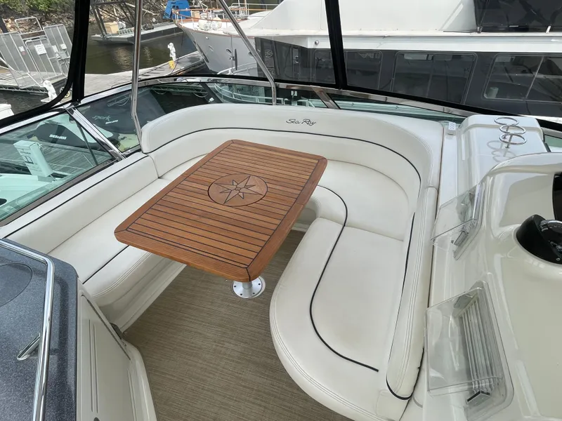 Slide: The Image of Luxurious 2005 Sea Ray 500 Sedan Bridge yacht with elegant seating and wooden table. - 30