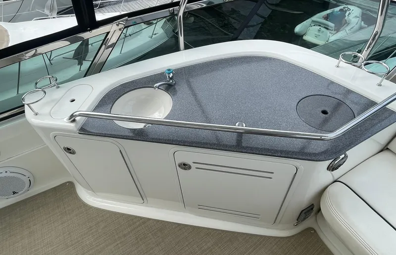 Slide: The Image of 2005 Sea Ray 500 Sedan Bridge yacht interior with sink and storage area. - 31