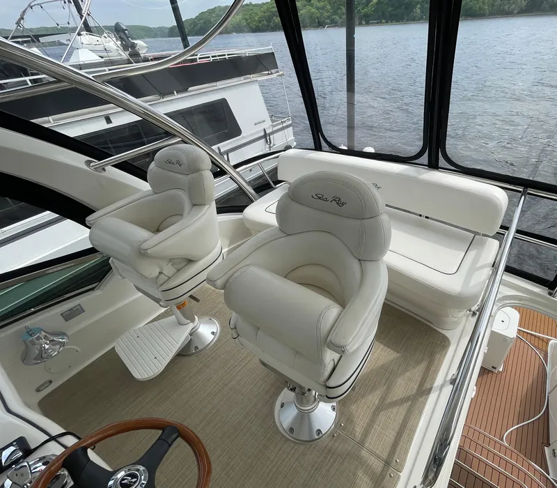 Slide: The Image of Luxurious 2005 Sea Ray 500 Sedan Bridge yacht interior with plush seating and scenic water view. - 32