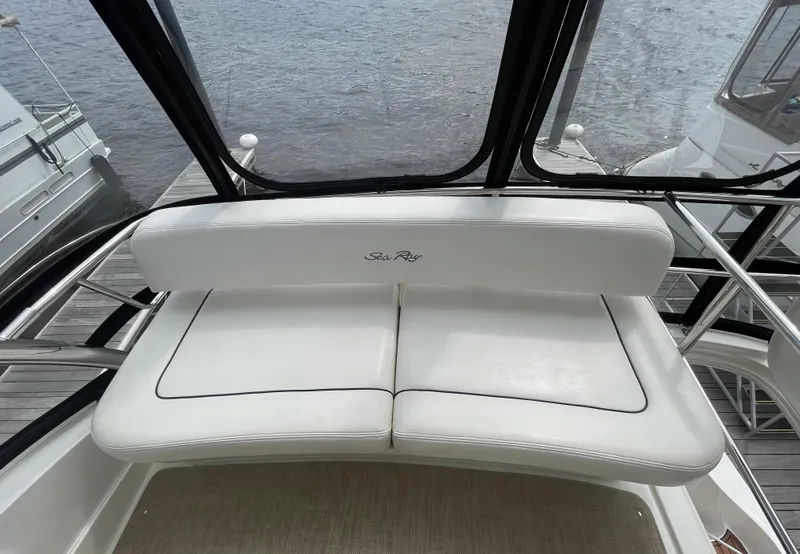Slide: The Image of White seating on 2005 Sea Ray 500 Sedan Bridge yacht, overlooking water. - 34