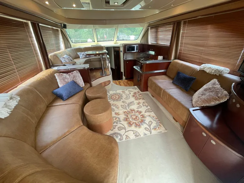 Slide: The Image of Luxurious interior of a 2005 Sea Ray 500 Sedan Bridge yacht with plush seating and elegant decor. - 43