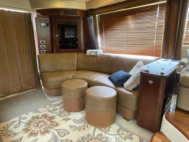 Slide: The Image of Luxurious interior of 2005 Sea Ray 500 Sedan Bridge with leather seating and elegant decor. - 45