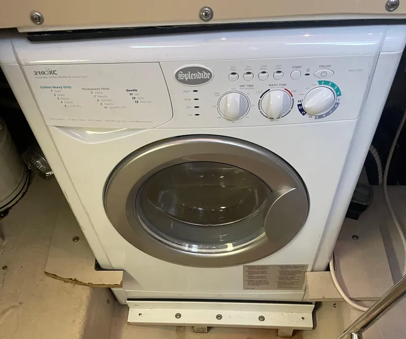 Slide: The Image of Splendide washing machine installed on a 2005 Sea Ray 500 Sedan Bridge yacht. - 48