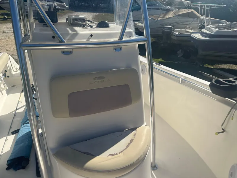 Slide: The Image of 2018 Cobia 220 Center Console boat interior with seating and console details. - 21