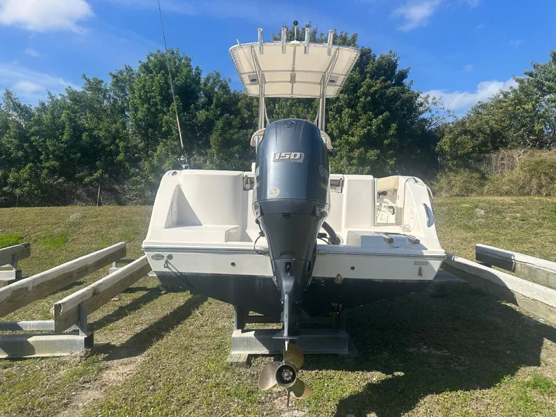 Slide: The Image of 2018 Cobia 220 Center Console boat with Yamaha 150 outboard motor on trailer. - 3
