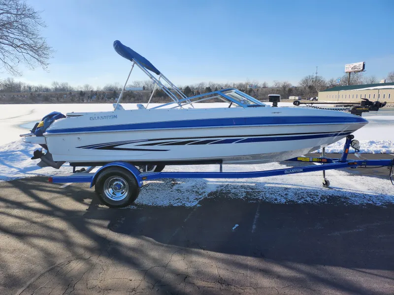 Slide: The Image of 2008 Glastron GT 205 Ski & Fish boat on trailer, parked on snowy pavement. - 10