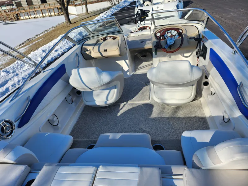 Slide: The Image of 2008 Glastron GT 205 Ski & Fish boat interior with white and blue seating. - 11