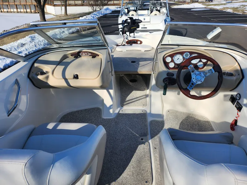 Slide: The Image of 2008 Glastron GT 205 Ski & Fish boat interior with steering wheel and seating. - 12