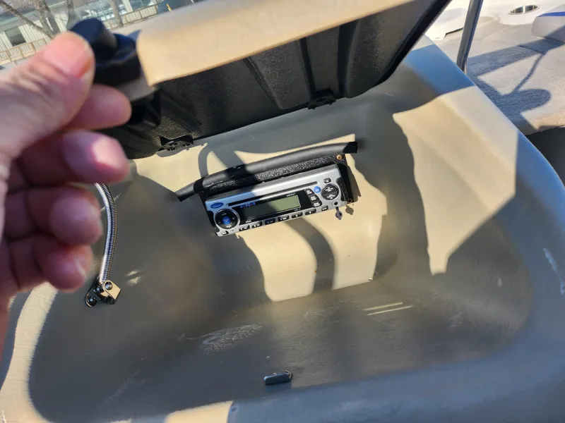 Slide: The Image of 2008 Glastron GT 205 Ski & Fish boat storage compartment with stereo system. - 18