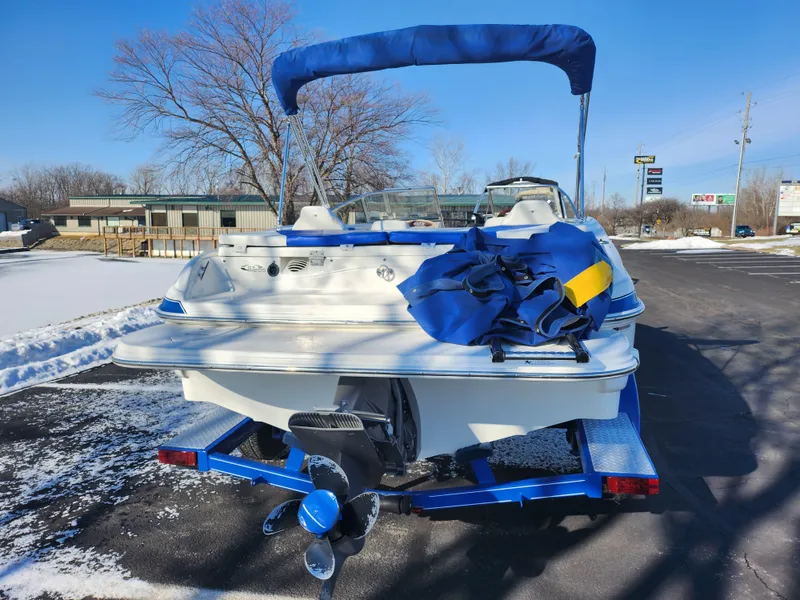 Slide: The Image of 2008 Glastron GT 205 Ski & Fish boat on trailer, rear view, with blue cover. - 2