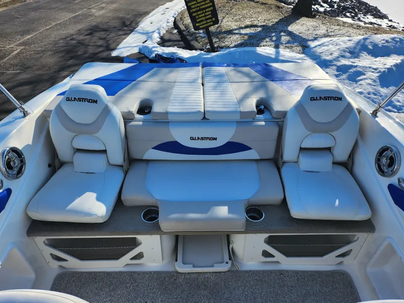 Slide: The Image of 2008 Glastron GT 205 Ski & Fish boat interior with cushioned seating and storage. - 23