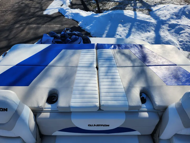 Slide: The Image of 2008 Glastron GT 205 Ski & Fish boat interior with blue and white seating. - 24