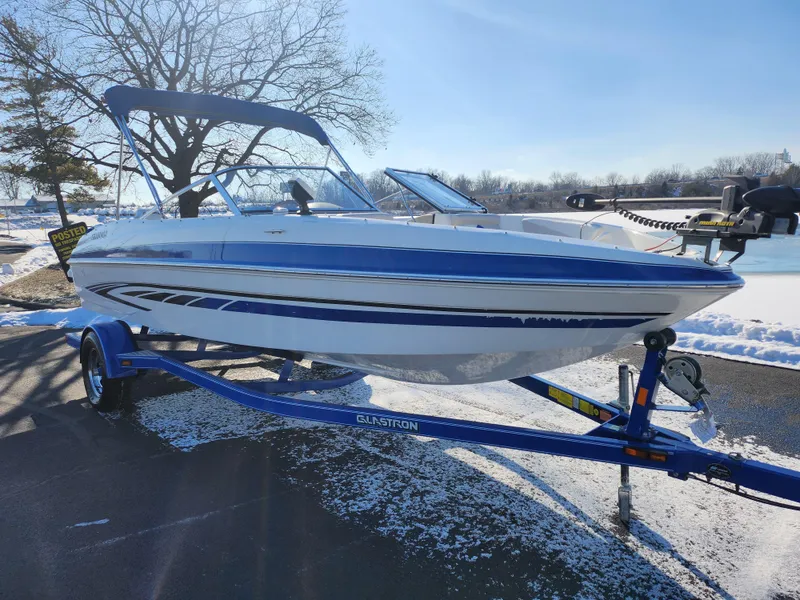 Slide: The Image of 2008 Glastron GT 205 Ski & Fish boat on trailer, parked in snowy outdoor setting. - 9