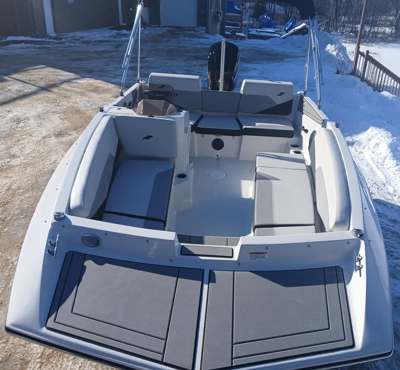 Slide: The Image of 2025 Starcraft SV 16 OB boat with spacious seating, parked on snowy ground. - 2