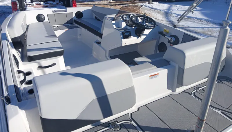 Slide: The Image of 2025 Starcraft SV 16 OB boat interior with seating and steering console. - 3