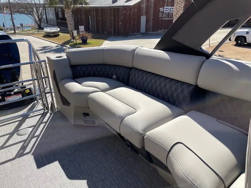 Slide: The Image of 2025 Barletta Lusso 25QSS boat interior with luxurious seating and elegant design. - 12