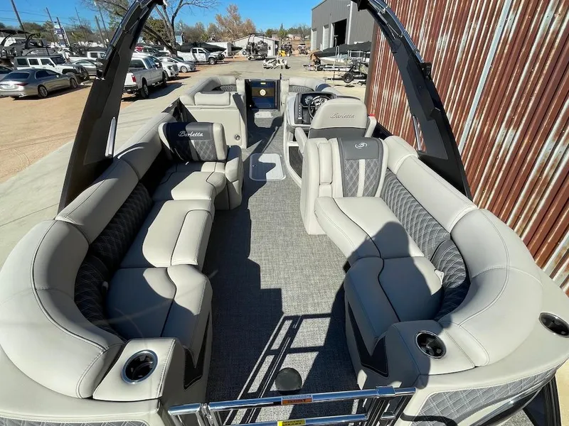 Slide: The Image of 2025 Barletta Lusso 25QSS pontoon boat with luxurious seating and modern design. - 4