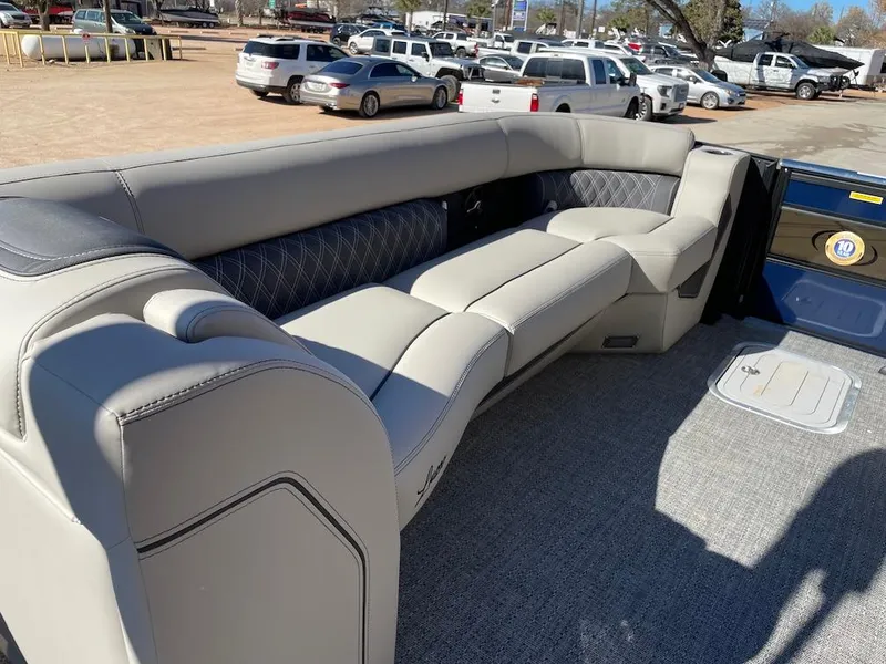 Slide: The Image of 2025 Barletta Lusso 25QSS pontoon boat interior with luxurious seating and modern design. - 7