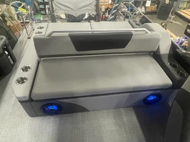 Slide: The Image of Luxury seating on 2025 South Bay 500 boat with cup holders and blue LED speakers. - 10