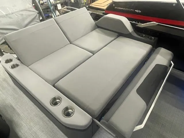 Slide: The Image of Luxurious seating on 2025 South Bay 500 boat with cup holders. - 13