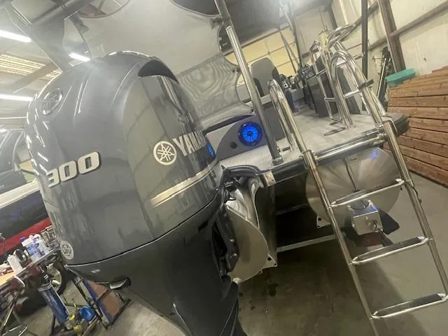 Slide: The Image of 2025 South Bay 500 boat with Yamaha 300 engine in a workshop. - 18