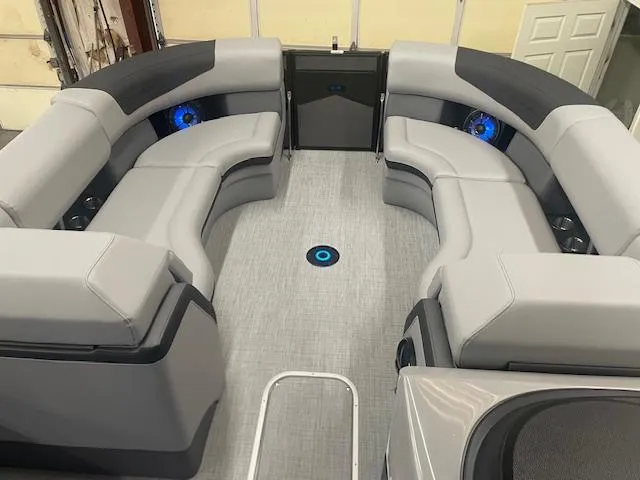 Slide: The Image of Luxurious interior of 2025 South Bay 500 boat with modern seating and blue LED lights. - 5